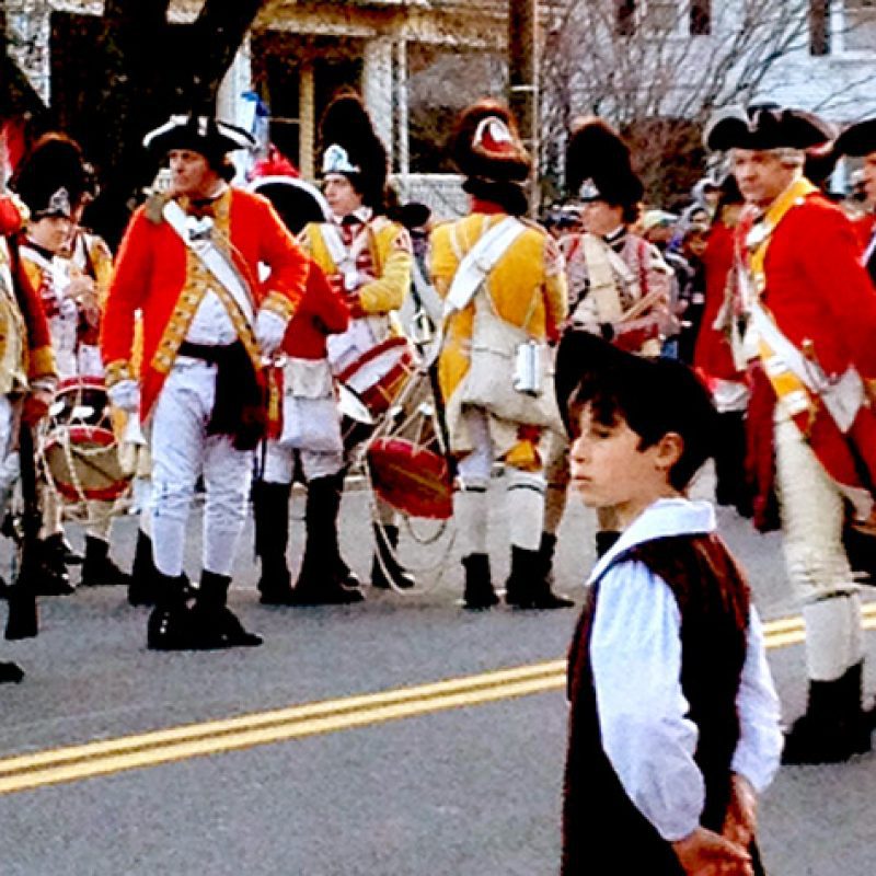 soldiers in the street with rifles in uniform for Patriots Day