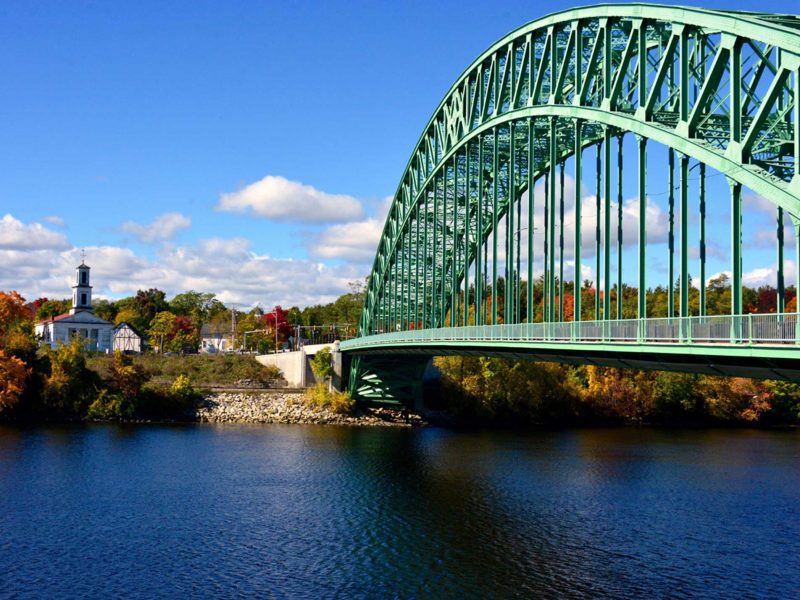 Tyngsborough Bridge with a church standing to the left of the bridge